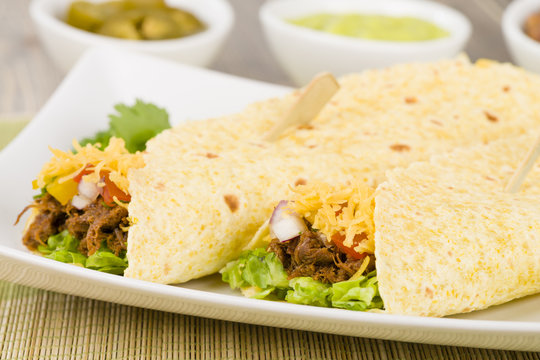 Shredded beef taco with salsa, sour cream and cheese