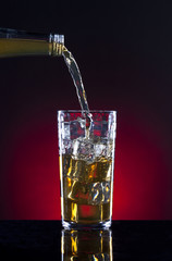 Serving up a glass of liquor.