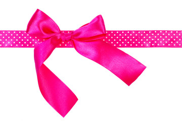 Pink gift bow and ribbon on white background