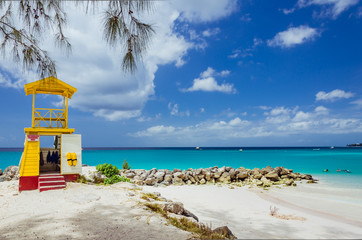Lifeguard Tower on a Beach with Blue Sky and Turquoise Water - obrazy, fototapety, plakaty