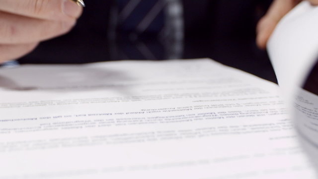 Close up of businessman signing a contract