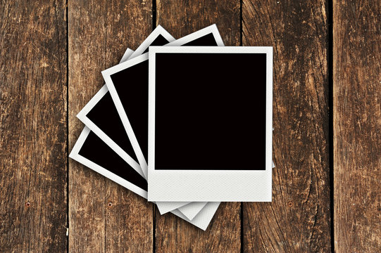 Four Polaroid old wood background