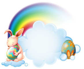 A bunny hugging an easter egg near the rainbow