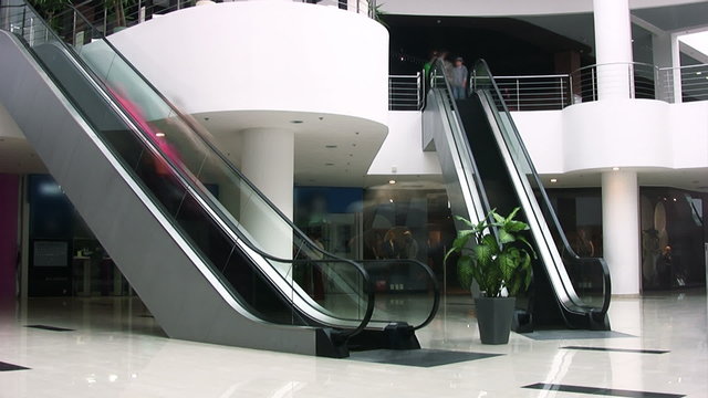 Escalators in shopping center. Timelapse