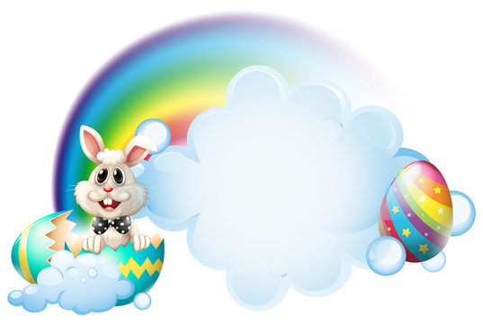 A cracked egg with a bunny near the rainbow