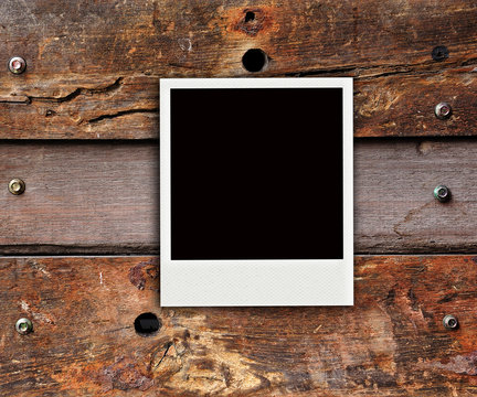 one polaroid photo on wood background