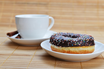 cup of coffee with sweet donut