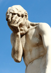 Tuileries Garden in Paris, near Louvre. A facepalm statue.