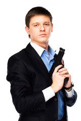 Naklejka premium young and handsome man with a gun in his hand