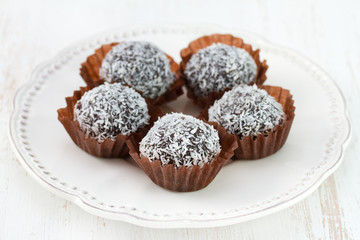 chocolate truffles with coconut on the plate