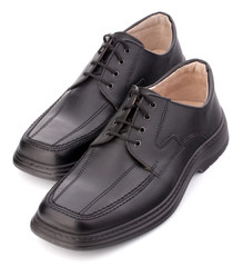 Black glossy man’s shoes with shoelaces