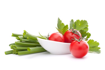 Spring onions and cherry tomato in bowl