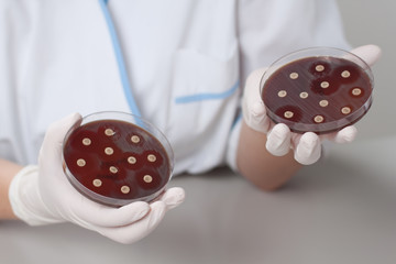 Lab scientist with petri dish