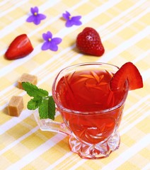 Fresh red tea and tasty fruit with mint
