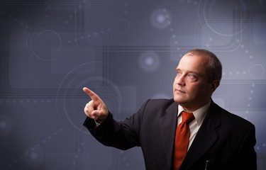 Elegant businessman touching copy space