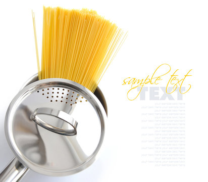 Pasta spaghetti in pot pan on a white background
