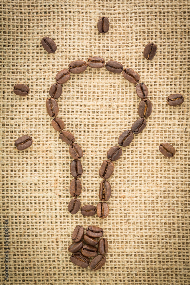 Poster light bulb made out of coffee beans with light beams