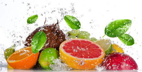 Fresh fruits with water splash isolated on white