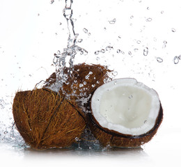 cracked coconut with splashing water