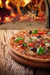 Delicious italian pizza served on wooden table