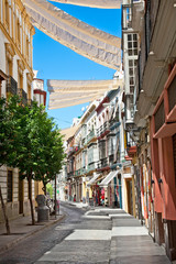 Street in Seville on summer day, Andalucia, Spain.