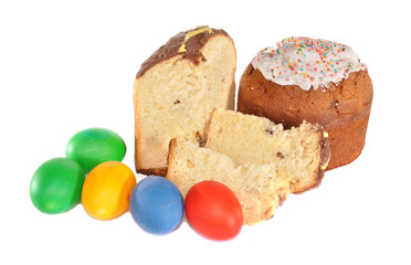 Pieces of an easter cake and multi-coloured eggs