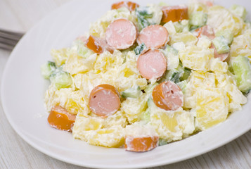 salad made of potato, cucumber, onion with mayonnaise dressing