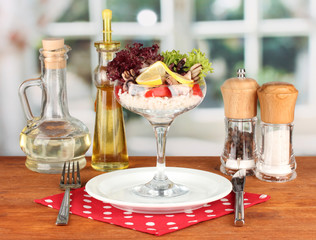 Delicatessen seafood salad with rice in glass