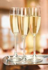 Corporate party: sparkling champagne glasses on tray