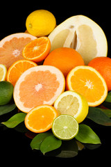 Lots ripe citrus isolated on black