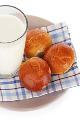 Bread rolls and glass of milk isolated on white