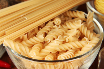 Different types of pasta on striped tablecloth