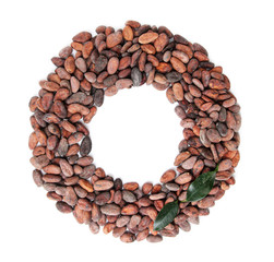Cocoa beans with leaves isolated on white