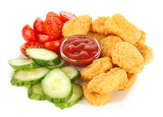 Fried chicken nuggets with sauce and vegetables isolated
