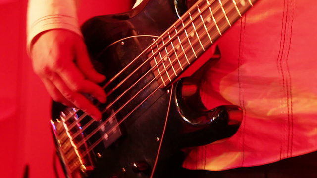 Man playing electric bass guitar