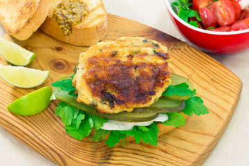 Grilled chicken sandwich on a bun with pickles