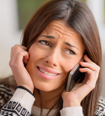 Young Woman Crying On Cell Phone