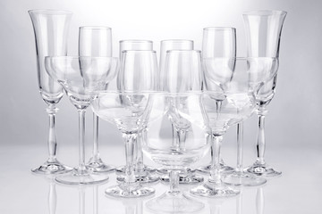 Cocktail and wine glasses, on gray background