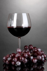 Red wine glass on grey background