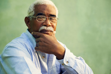 Portrait of serious african american old man looking at camera - Powered by Adobe