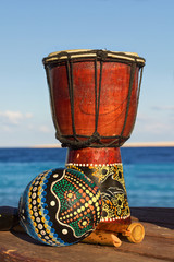 maracas and ethnic drum on the beach