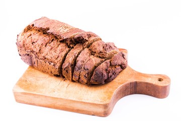 Fresh sliced homemade brown bread with cereals isolated