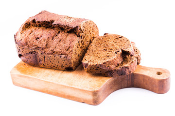 Fresh sliced homemade brown bread with cereals isolated