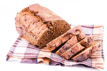 Fresh sliced homemade brown bread with cereals isolated