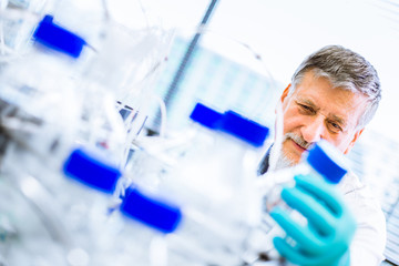 Senior male researcher carrying out scientific research in a lab