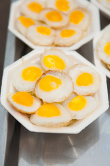 Fried quail egg with foam plate
