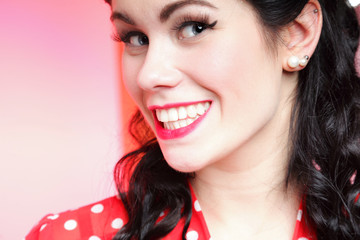 woman pin-up make-up hairstyle posing in studio