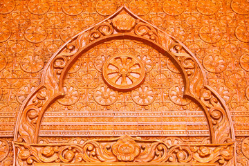 Thai sculpture made from glazed tile, in Thailand Temple