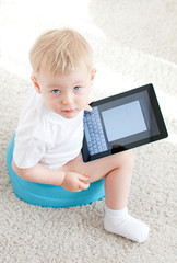 little boy on the chamder with tablet pc - 50633143