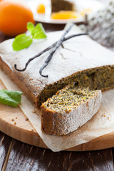 cake with poppy seeds under icing sugar